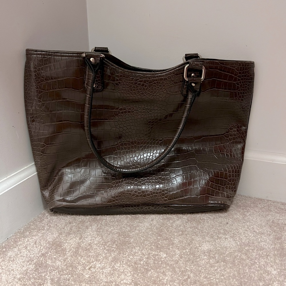 Brown textured print purse with elbow handles.